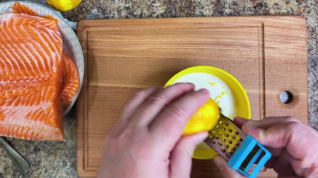 the process of salting salmon fish. lemon zest is