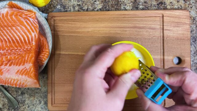 the process of salting salmon fish. lemon zest is