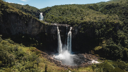 Salto do Rio Preto waterfall, Chapada dos Veadeiros Nacional Park, Goiás, Brazil, aerial view, large waterfall 120m high, sunny day, rainbow