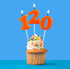 Orange birthday candle and cupcake - Number 120.