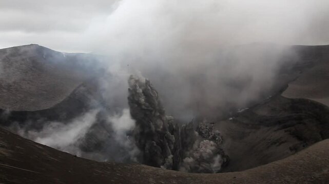 Ash-rich eruptions from rim of active crater on Mount Yasur volcano in Vanuatu.