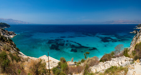 Albania, Vlorë County, Ksamil, Shpella e Pëllumbave - 17 August 2024 - Extraordinary panoramic view from above of Shpella and Pëllumbave beach in Ksamil and the colorful sea