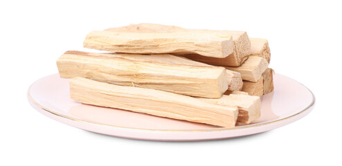 Pile of palo santo sticks on white background