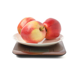 Modern electronic kitchen scale with apples isolated on white