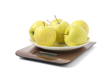 Modern electronic kitchen scale with apples isolated on white