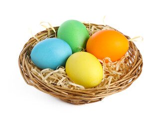 Many decorated Easter eggs in basket isolated on white
