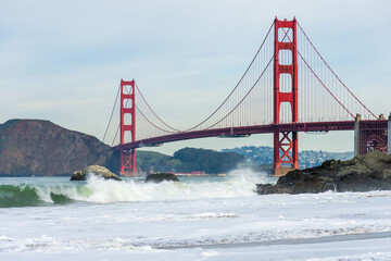 Surf in front of Golden Gate Bridge worldwide known symbol of California