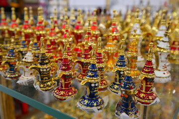 Fototapeta premium Colorful miniature decor items displayed in a shop in Abu Dhabi, showcasing traditional craftsmanship from the Middle East