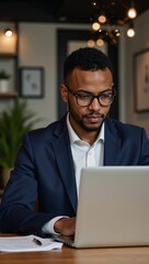 A stylish portrait of an African-American businessman working on his laptop against an officecafe backdrop with a bokeh effect featuring sparkling lights