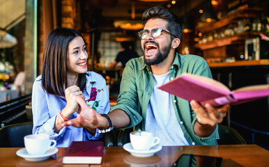Couple on coffee break. Young students learning in the cafe. Education, relationships, love concept