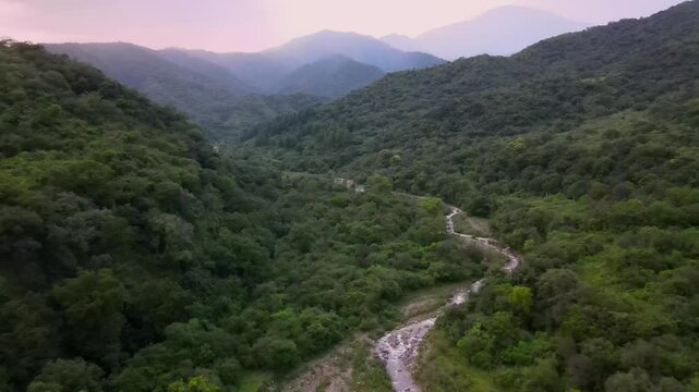 sunset green moutains crossing river