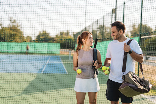 Two friends going to play tennis