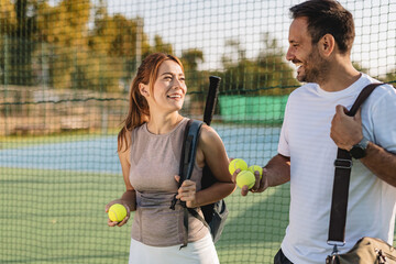 Two friends going to play tennis