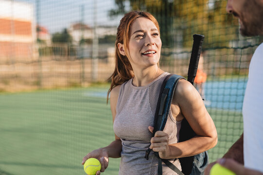 Two friends going to play tennis