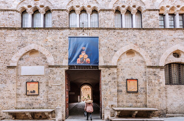 Obraz premium The Palazzo Chigi-Saracini is a Gothic urban palace located on the Via di Citta in central Siena. It was built by the Marescotti family in the 12th century. Siena, Italy 2019.