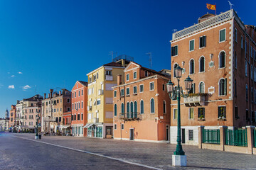 The Riva Degli Schiavoni was built in the 19th century and it is a promenade that sits on the waterfront at St. Mark's Basin and main pedestrian street, overcrowded of tourists in Venice. Italy, 2019