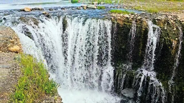 A majestic waterfall plunges into a lush valley, surrounded by rocks and greenery.
📍Marivan - Kurdistan  