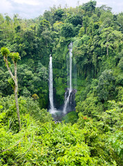 Tropical rainforest Sekumpul waterfalls in Bali, Indonesia. Far angle view.
