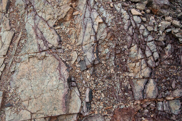 Closeup of broken rocks and shale chips on a mountain in a desert
