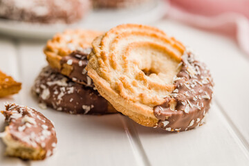 Sweet chocolate cookies on white table.