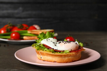 Plate with tasty egg Benedict on table