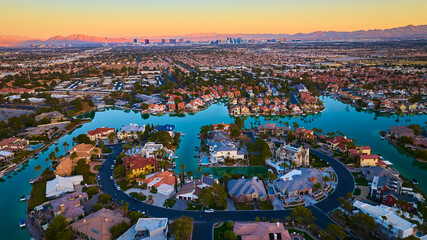 Aerial of Las Vegas Suburb at Sunset with Waterways and Cityscape © Nicholas J. Klein