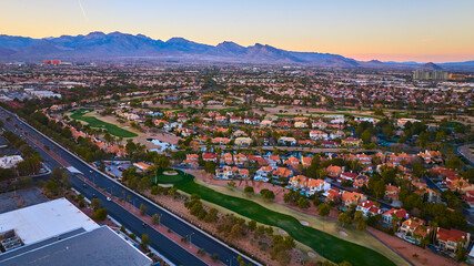 Aerial of Suburban Las Vegas Golf Course and Cityscape at Sunset © Nicholas J. Klein