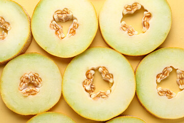 Slices of sweet melon on yellow background