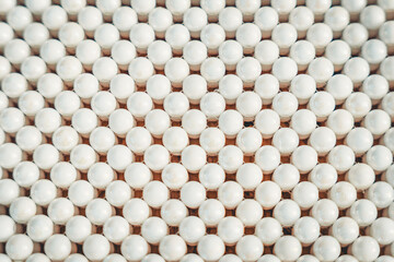 background made of many white rounded beads like pearls