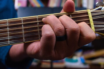 A Hand Forming a Chord on a Guitar © Joseph D Washburn