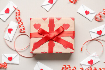 Gift box and envelopes on grey background. Valentine's Day celebration
