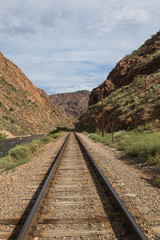 Fototapeta premium Railroad tracks next to the Arkansas River in Royal Gorge, Canon City, Colorado