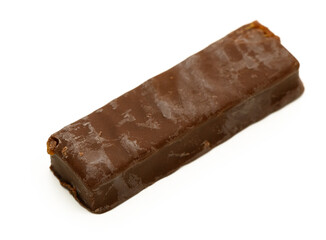 Delightful chocolate bar resting on a clean surface showcasing its smooth texture and rich color