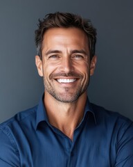 Fototapeta premium Confident Businessman Smiling Isolated on Neutral Gray Background