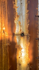 Old rusty damaged metal plate, textured surface with cracks and damaged abstract background.
