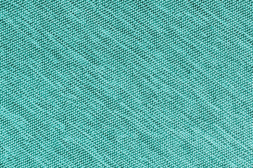 Closeup, macro of turquoise fabric texture background. Satin diagonal weaving cloth structure,...
