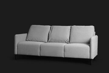 Grey sofa on black background