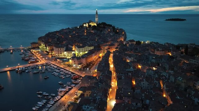 Rovinj night view, St. While Euphemia Church rises at the top of the island, historical streets and harbor lights reflect the fascinating atmosphere of the city.