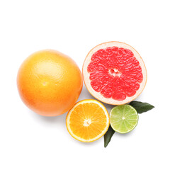 Ripe citrus fruits and leaves on white background