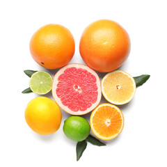 Ripe citrus fruits and leaves on white background