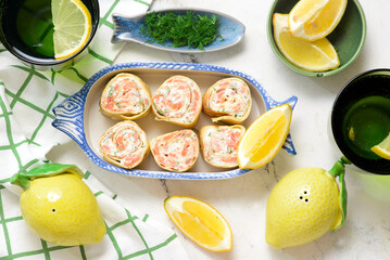  crepes rolls with cream cheese, salmon and dill. top veiw.