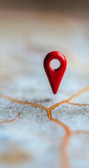 Red map marker on blurred city map, highlighting a location