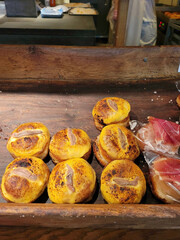 A beautifully crafted wooden tray filled with an assortment of food items on it