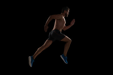 Sport athlete man run. Runner at long sport run. Sportsman runner running isolated on black. Sport run. Muscular man running. Sportsman jogger running. Man sportsman running for exercise