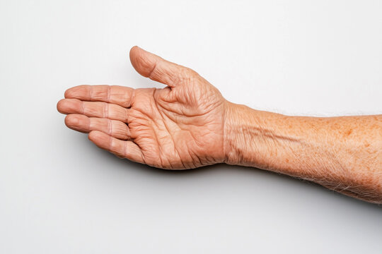 Elderly hand with visible wrinkles and skin texture, palm open. - Powered by Adobe
