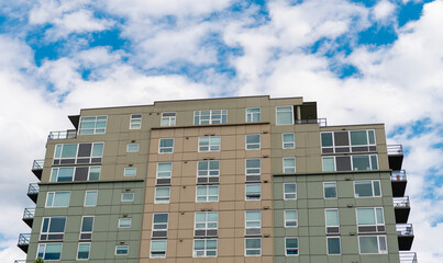 Fototapeta premium Architectural building in neighborhood. Building perspective view. Condominium architecture. Architecture of residential building. Residential house. Modern condominium building exterior