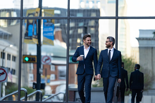 Businessmen go to work. Business talking. Two businessmen in elegant business suit. Walking colleague. Colleague and friends. Two successful business men walking outdoor. Business district