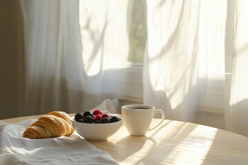 Morning breakfast setting with croissant, berries, and coffee by a sunlit window
