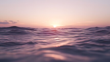 Obraz premium Serene ocean sunset view, soft focus on rippling water surface.