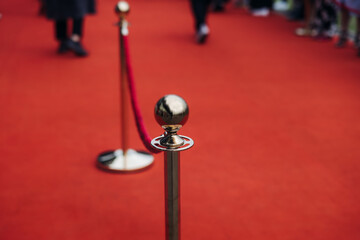 Red carpet with ropes and golden barriers on a luxury party entrance, cinema premiere tv film...